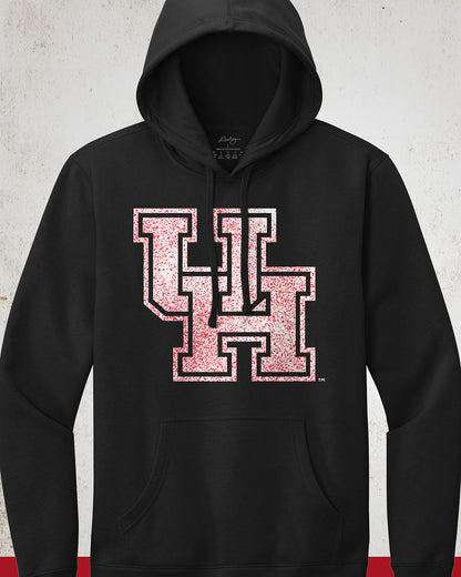 Image showing a black University of Houston hoodie with a white UH logo with red speckles stretched across the front.