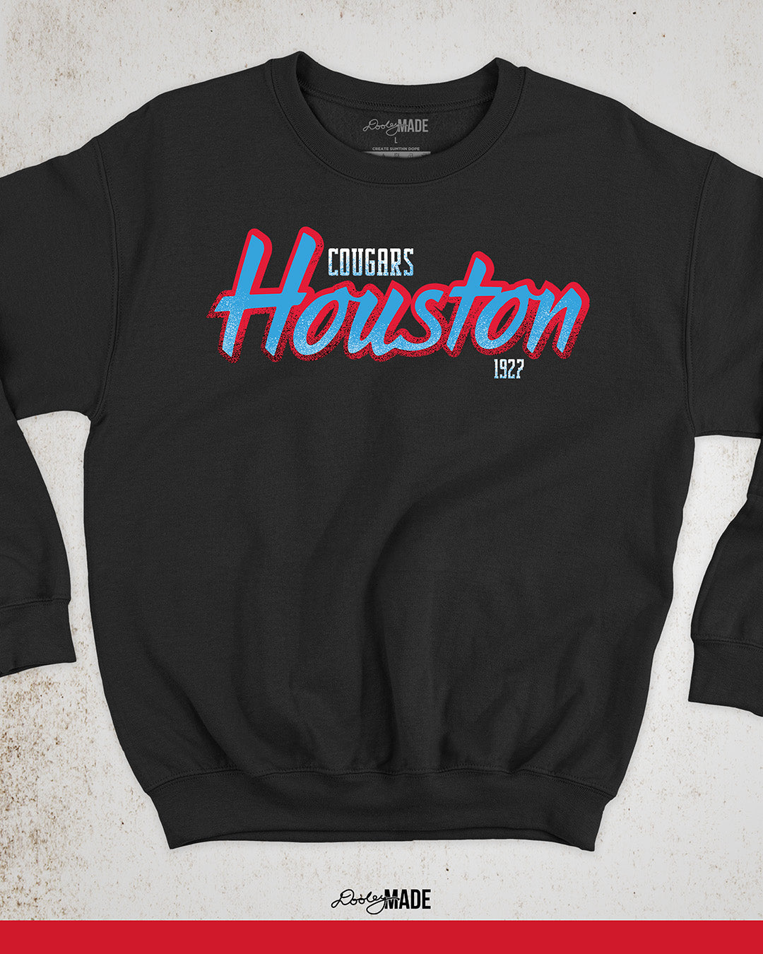 A black University of Houston Cougars themed crewneck sweatshirt with Houston written in Oiler Blue script text with a red outline. The text Cougars is above in white and 1927 is below in white. The text contains grunge texture on its lower half.