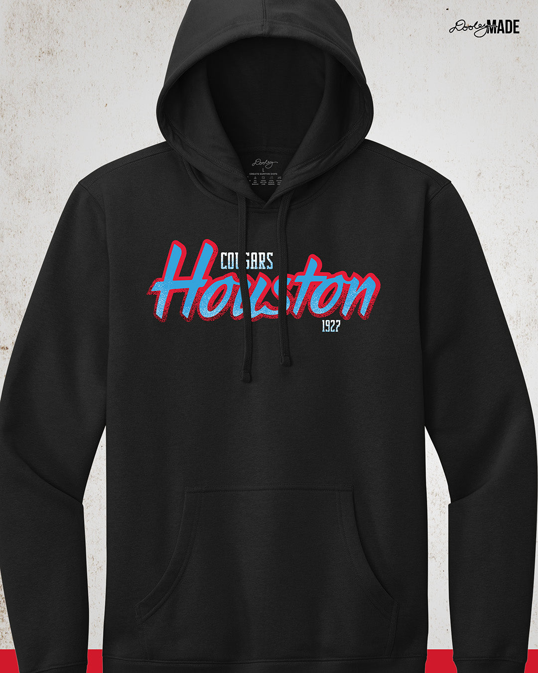 A black University of Houston Cougars themed hoodie with Houston written in Oiler Blue script text with a red outline. The text Cougars is above in white and 1927 is below in white. The text contains grunge texture on its lower half.