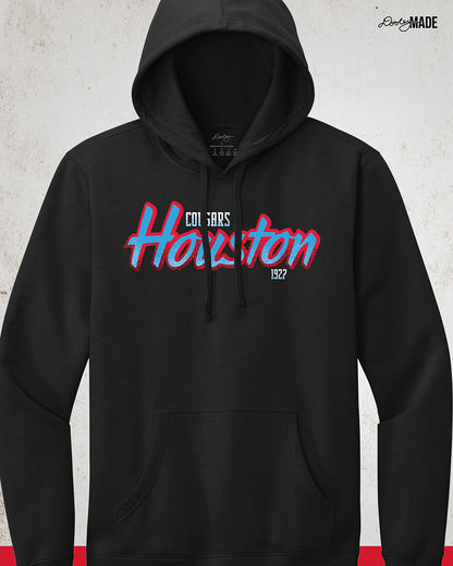 A black University of Houston Cougars themed hoodie with Houston written in Oiler Blue script text with a red outline. The text Cougars is above in white and 1927 is below in white. The text contains grunge texture on its lower half.