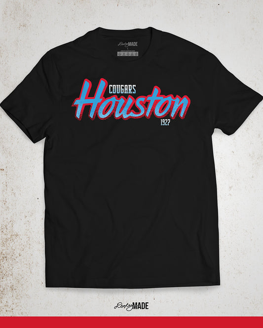 A black University of Houston Cougars themed shirt with Houston written in Oiler Blue script text with a red outline. The text Cougars is above in white and 1927 is below in white. The text contains grunge texture on its lower half.