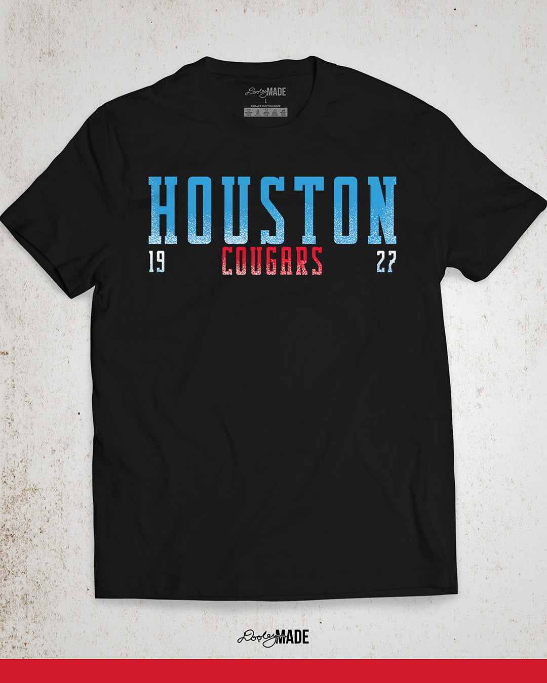 A black University of Houston Cougars themed shirt with "Houston" written in Oiler Blue block text. The text "Cougars" is below in white and 1927 is split below in white. The text contains a white grunge texture on its lower half. Perfect for alumni, students, and fans.