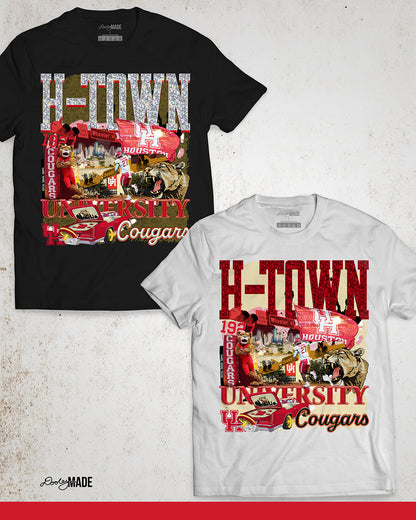 A black and white University of Houston themed shirt featuring a vibrant HTOWN University graphic collage with "H-TOWN" text in diamonds, Cougar mascot, players, city skyline, and classic lowrider in a vibrant collage design.