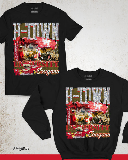 A black University of Houston themed shirt and crewneck sweater featuring a vibrant HTOWN University graphic collage with "H-TOWN" text in diamonds, Cougar mascot, players, city skyline, and classic lowrider in a vibrant collage design.