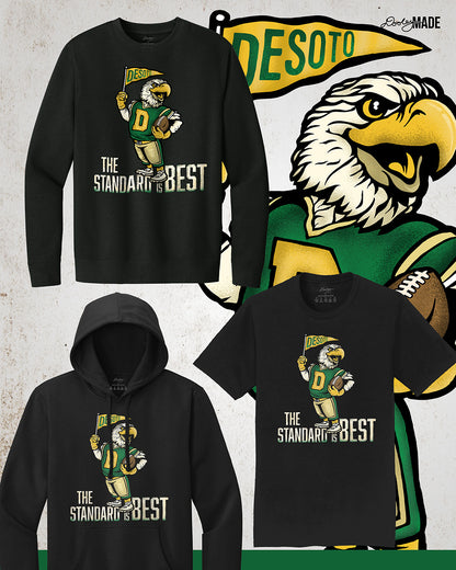 Vintage black crewneck sweatshirt,  hooded sweatshirt, and shirt featuring a retro-inspired eagle mascot holding a football and waving a "DeSoto" Pennant flag. Bold text reads "The Standard is Best," accented with green and gold colors, celebrating DeSoto High School pride and tradition.
